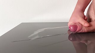 Huge jizz shot on reflecting table after days of edging