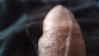 Youthful boy in close-up of his cute lubed penis