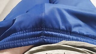 Guy in blue sweatpants caressing his erection